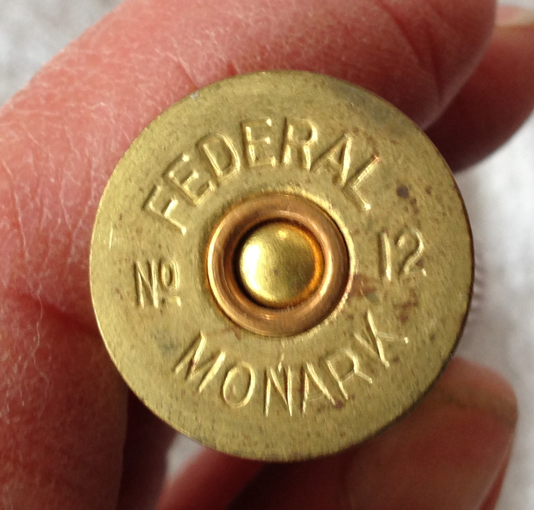 A vintage Federal Cartridge Monark 12 gauge shotgun shell wooden