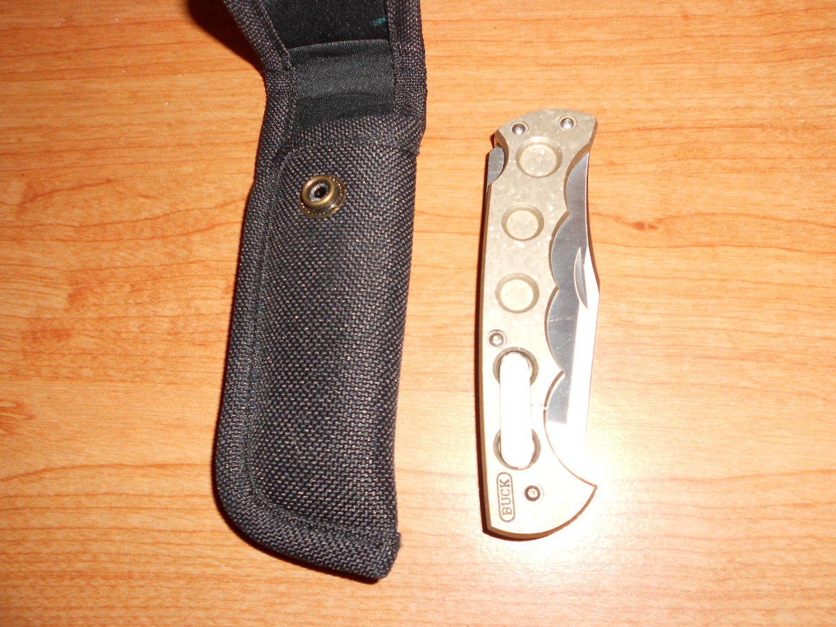 New Buck 560 Titanium push button open lock back knife 17120699