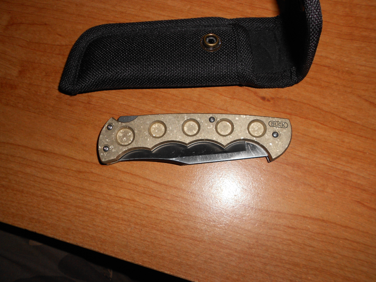 New Buck 560 Titanium push button open lock back knife 17120699