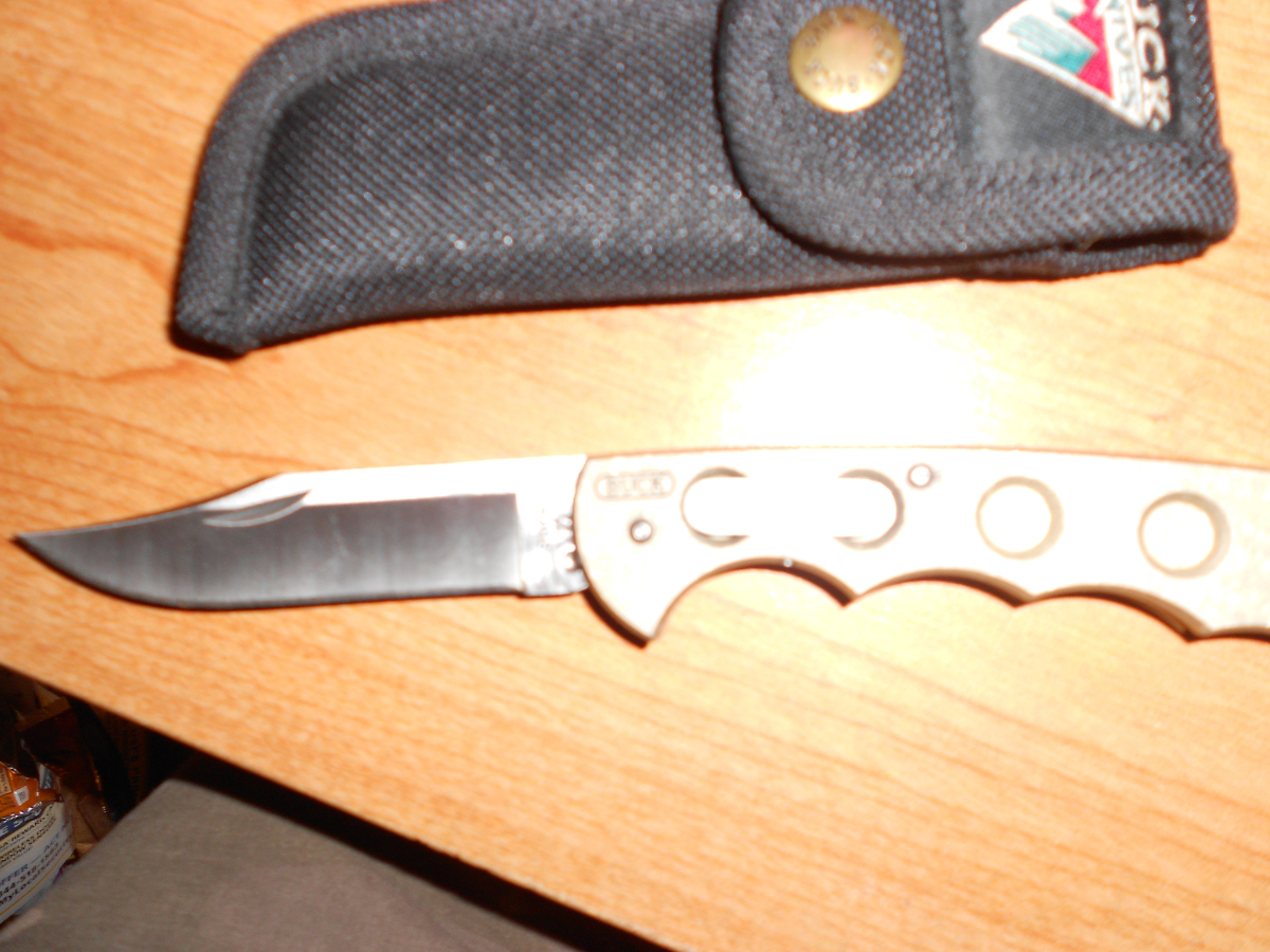 New Buck 560 Titanium push button open lock back knife 17120699