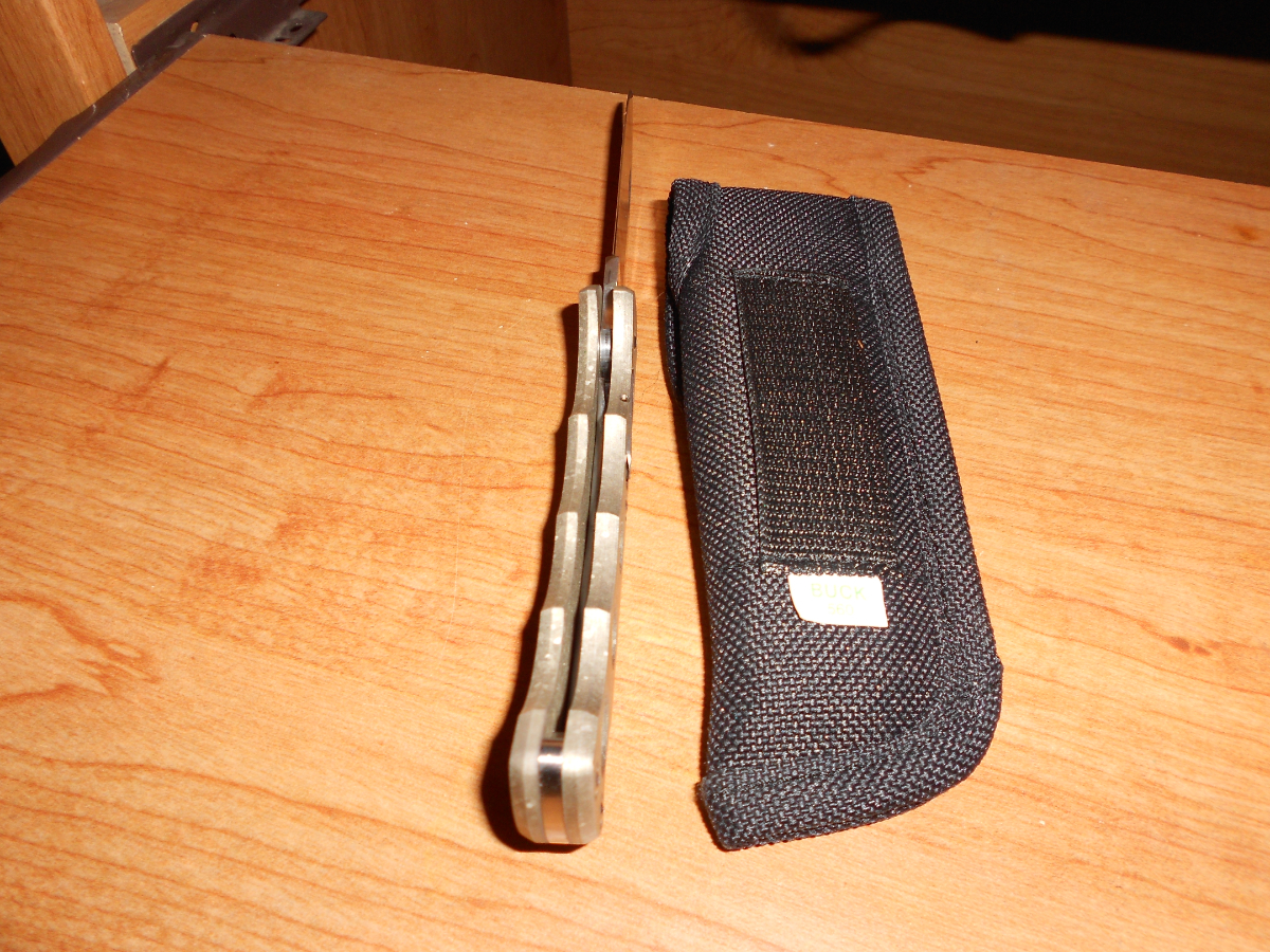 New Buck 560 Titanium push button open lock back knife 17120699