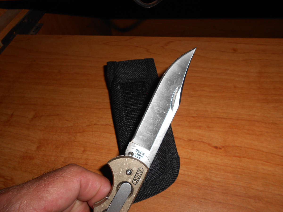 New Buck 560 Titanium push button open lock back knife 17120699