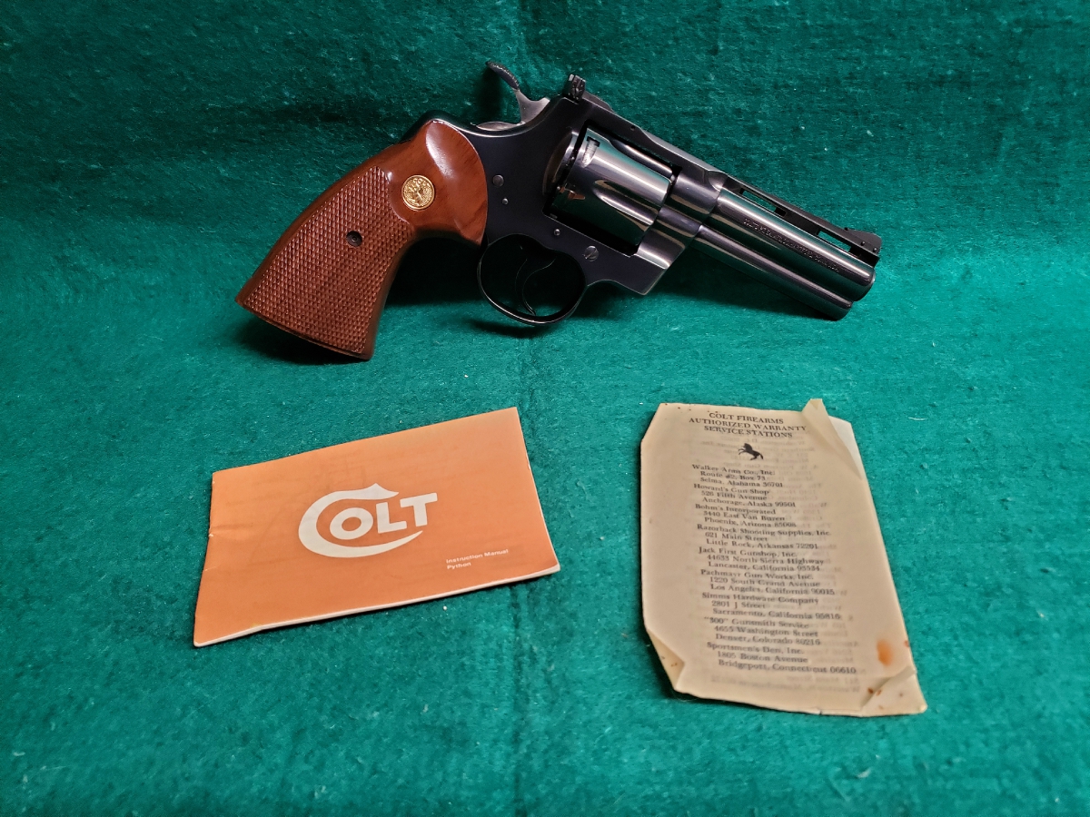 Colt PYTHON - BLUED. 4 INCH BARREL. ORIGINAL GRIPS. W-OWNERS MANUAL